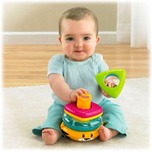 child achieves trunk balance, manipulates objects