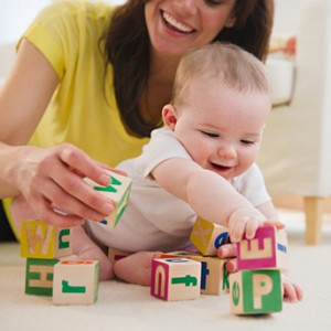 child develops forward reach, can hold objects